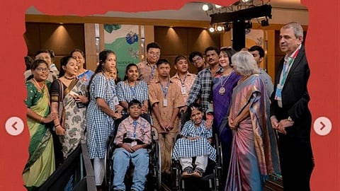 A group photo of some senior people and some school students in uniform sitting on wheelchair. 