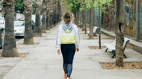 Image of a woman on a morning walk.