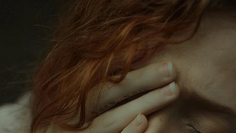 Close up image of a woman having depressed expression.