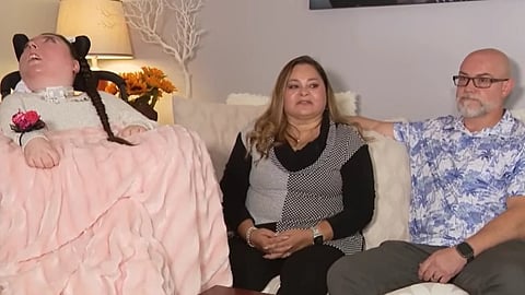 Image of Alex Simpson with her family.