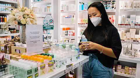 An image of a woman in a pharmacy.