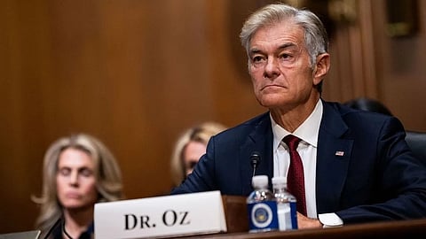 Dr. Oz testifying before the Senate, seated at a table with microphones.