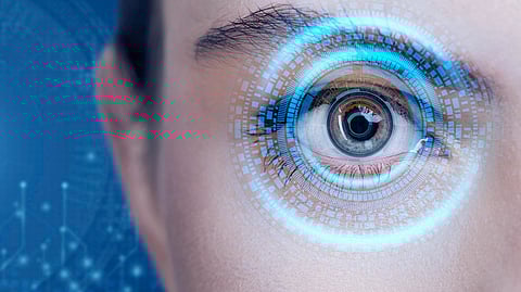 Image of an eye with glimpses of technology over it.