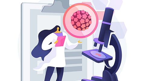  A woman in a lab coat examines a microscope, focused on her research in a laboratory setting.