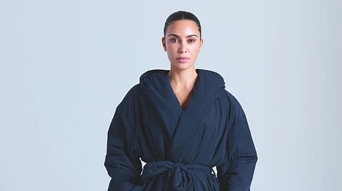An image of Kim Kardashian in a black robe. 