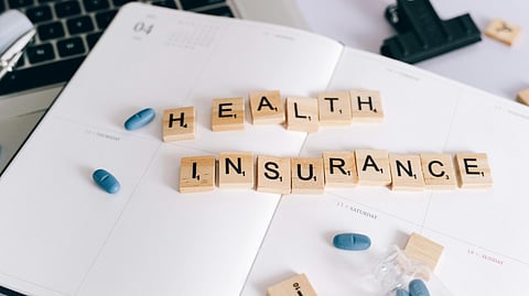 An image of blocks spelling health insurance.