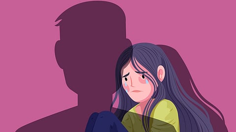 An Image of a girl looking scared and a shadow of a man.