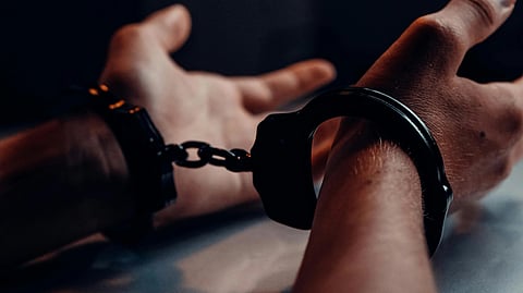 Image of a person being handcuffed.