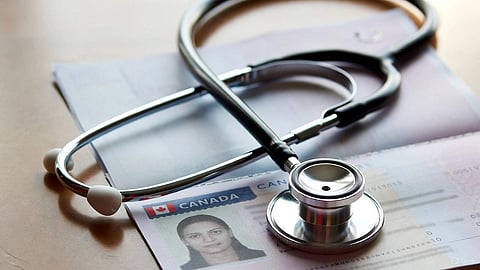 An image of a stethoscope and Canadian visa.