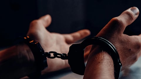 An image of a man in handcuffs.