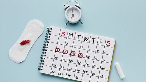 period calendar with sanitary napkin and tampon.