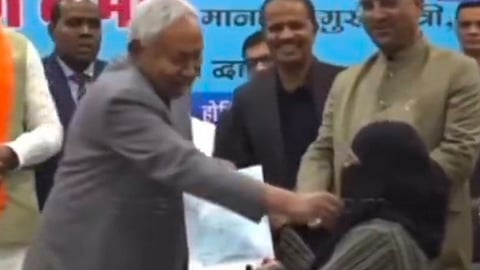 An image of Nitish Kumar during the ceremony when he pulled on a girl’s hijab.