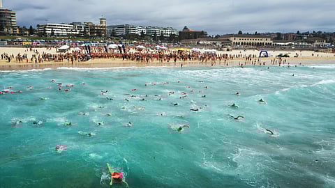An image of a beach and people enjoying there.