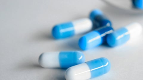 Image of blue and white capsules.