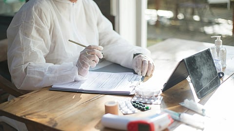An image of a doctor making a prescription.
