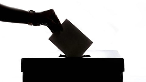 An image of ballot box and vote.
