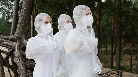 An image of people in hazmat suits.