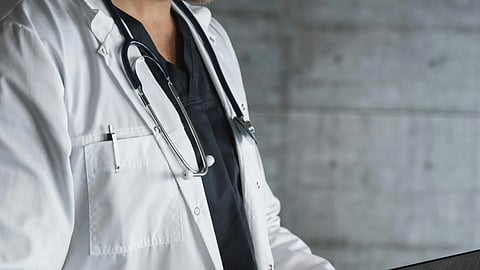 An image of a doctor in white court and a stethoscope.