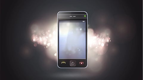 A mobile phone with some lighting around it.