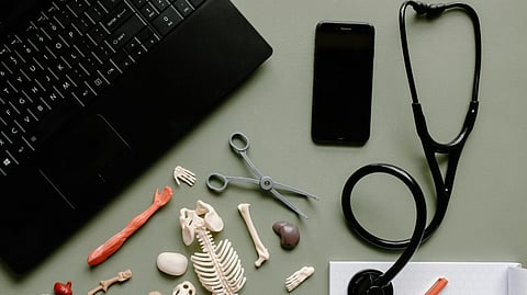 An image of stethoscope and medical body parts.