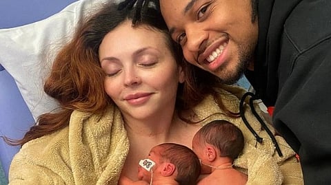 An image of Jesy Nelson and partner zionfoster with their twin babies.