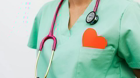 An image of a nurse with stethoscope around.