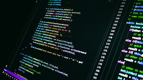 An image of a computer screen displaying colorful lines of code in an editing environment. 