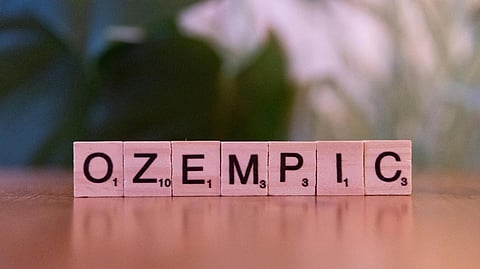 An image of ozempic spelt with letter blocks.