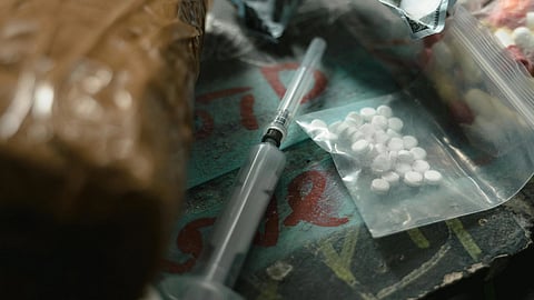 Pills in pouches and injections kept next to them.