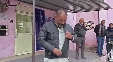 snakebite patient at a Mathura district hospital carrying the live snake that bit him