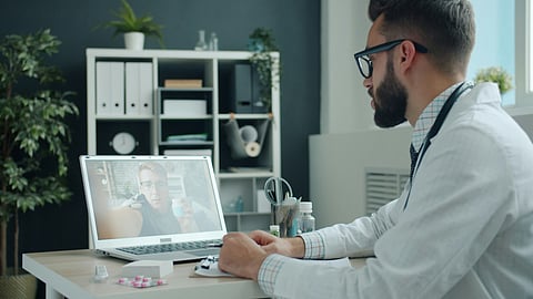 A healthcare professional conducts a remote consultation via a secure platform, showcasing telemedicine's role in modern healthcare.