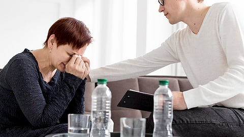 Front view of psychologist consulting a patient