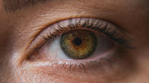 Close-up of a human eye with hazel iris.