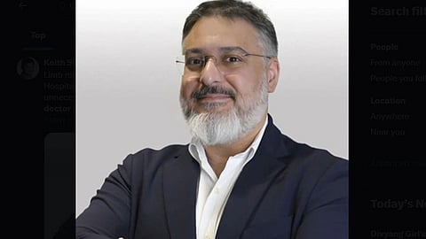 Yaser Jabbar from Great Ormond Street Hospital, wearing white shirt and black blazer.