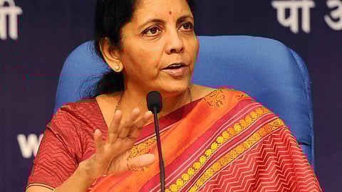 Close-up of Finance Minister Nirmala Sitharaman wearing a printed red saree.