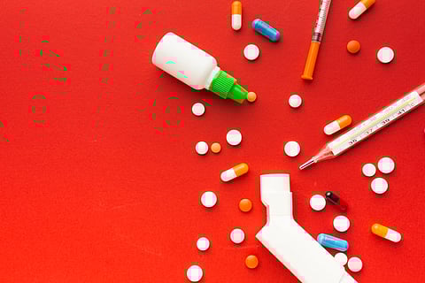 Top view medical pills and syringes