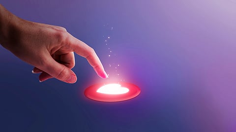 A hand reaches towards a glowing heart symbol on a purple background.