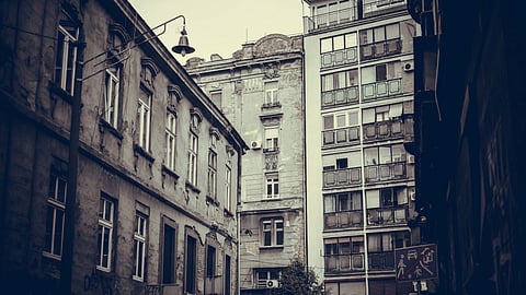 An old apartment building in black and white. 
