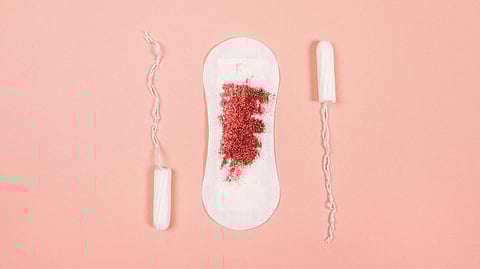 Sanitary towel with glitter and tampons