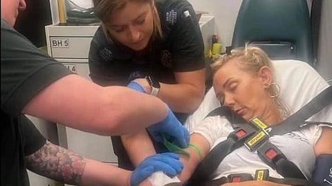 Michelle laying unconscious while doctors treat her in the mobile ambulance.