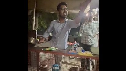 Doctor in white shirt shouting and throwing hands in air.