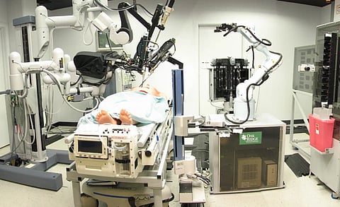 A patient under robotic surgery on a operation table. 