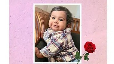 Girl, Aalin Sherin Abraham wearing a beige and black check shirt. 