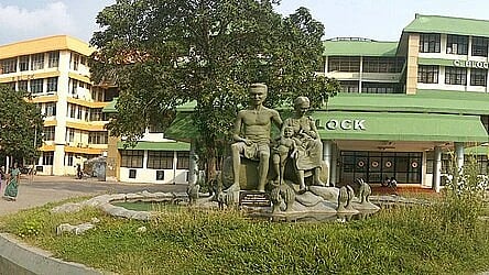 A green painted building of Alapuzha medical college. 