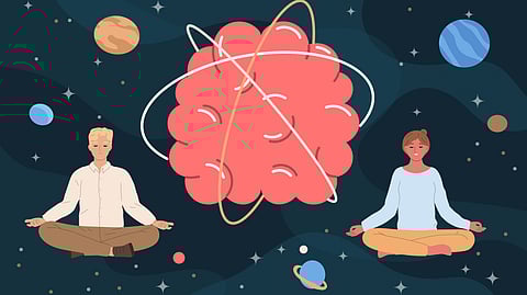 A man and woman sit cross-legged in meditation, surrounded by planets and stars in space.