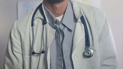 A doctor with stethoscope around neck.
