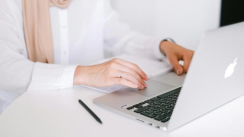 A doctor using laptop.
