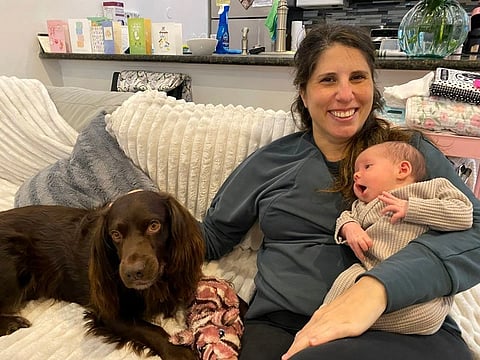 Lisa Bonfield cradles her newborn daughter, Adele, at home in New Orleans 