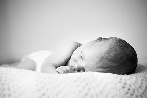 https://www.pexels.com/photo/grayscale-photo-of-baby-sleeping-2505101/