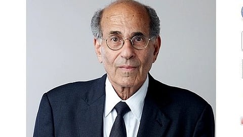 Richard Axel in a black suit and tie.